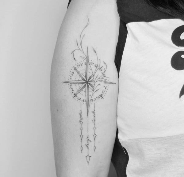 compass and vine with coordinates tattoo black and grey