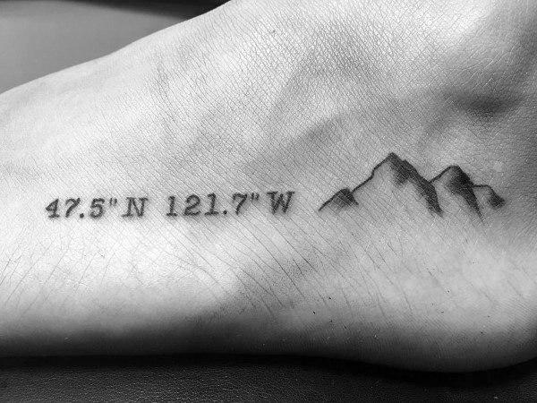 coordinate and mountain foot tattoo