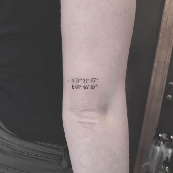coordinates tattoo above elbow tattoo