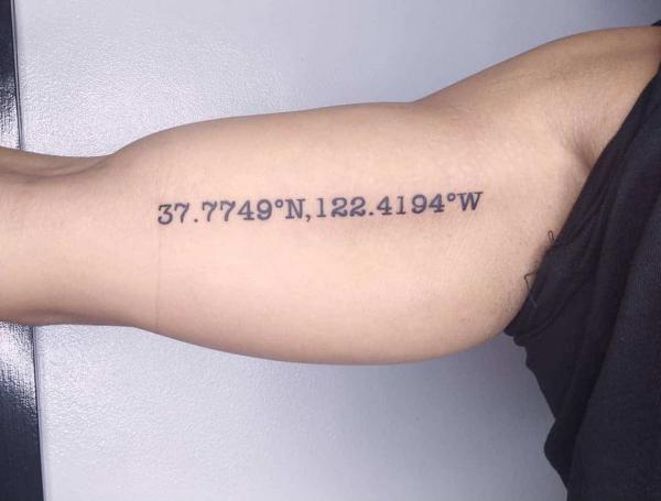 coordinates tattoo on bicep