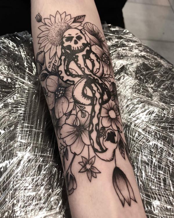 death eater with poppy and sunflower tattoo