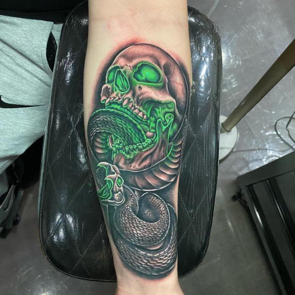 death eater with realistic skull and snake tattoo