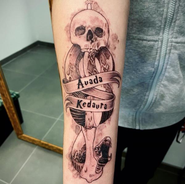 death eater with words avada kedavra tattoo