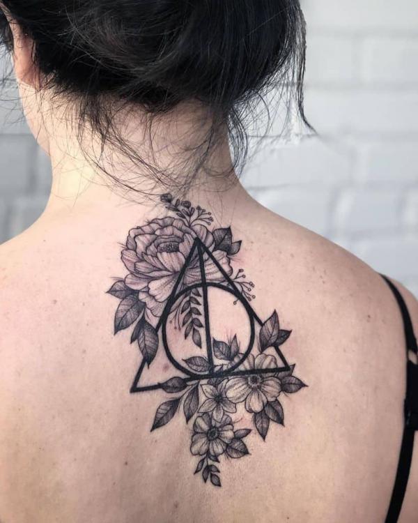 deathly hallows with peony and daisy tattoo