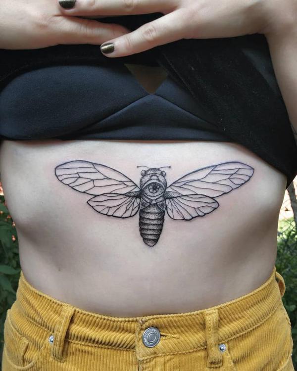 dotwork Cicada under boob tattoo