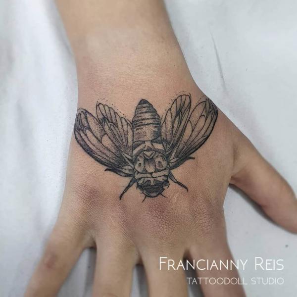hand cicada tattoo black and grey