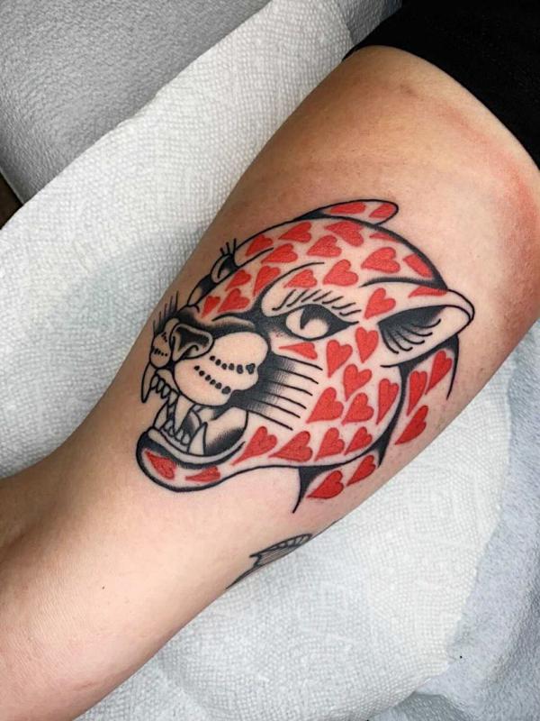 heart panther tattoo on bicep