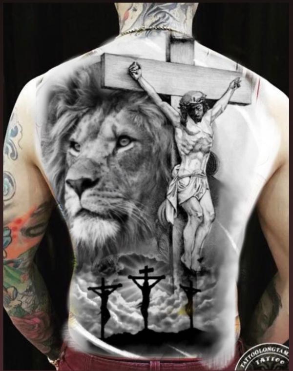 jesus on cross with lion tattoo