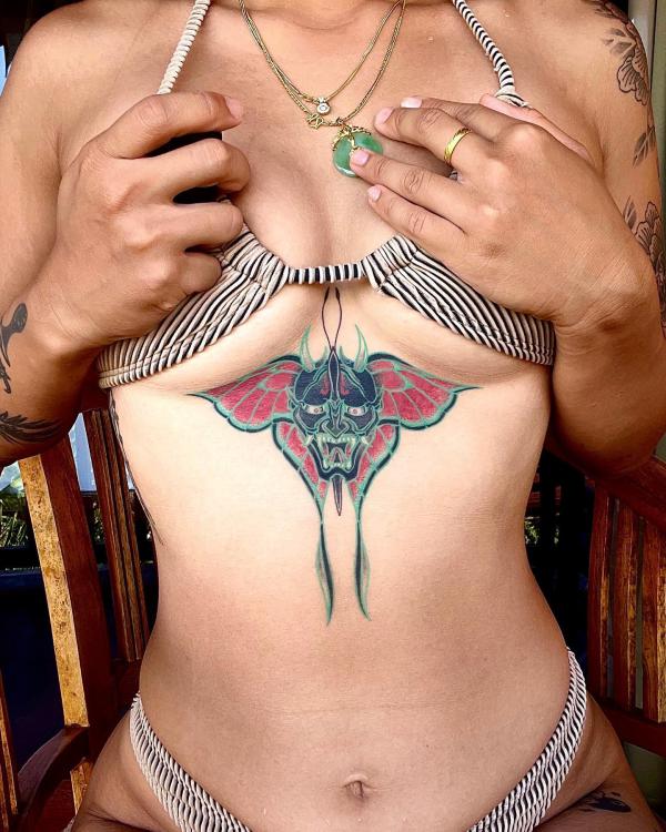 luna moth Oni mask sternum tattoo
