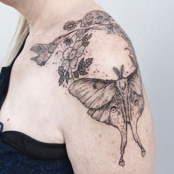 luna moth flowers and hummingbird shoulder tattoo black and grey