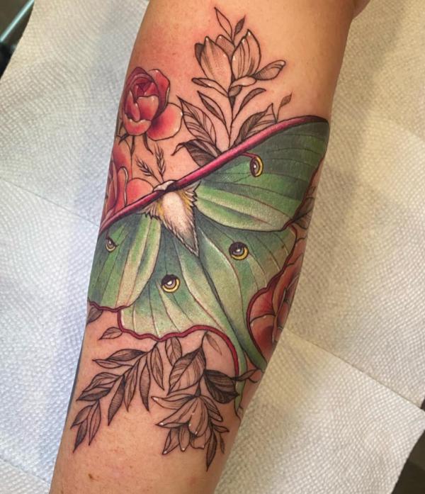 luna moth forearm tattoo