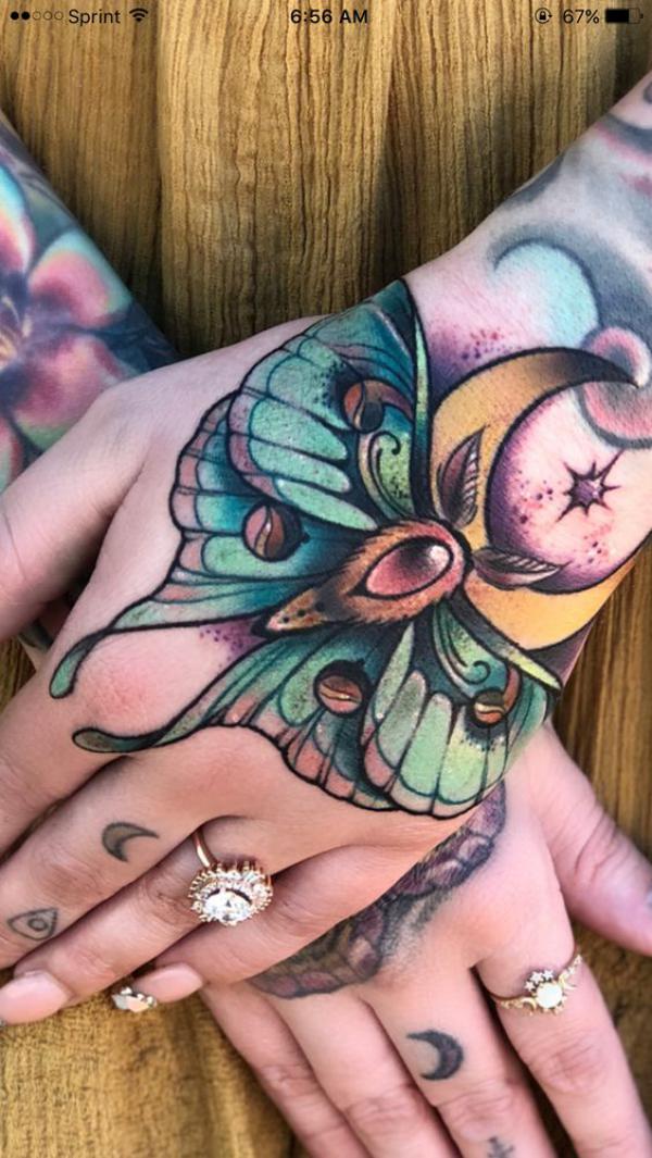 luna moth with dianond and crescent moon hand tattoo
