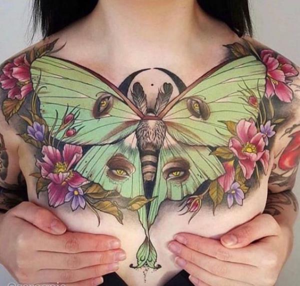 luna moth with eyes chest tattoo