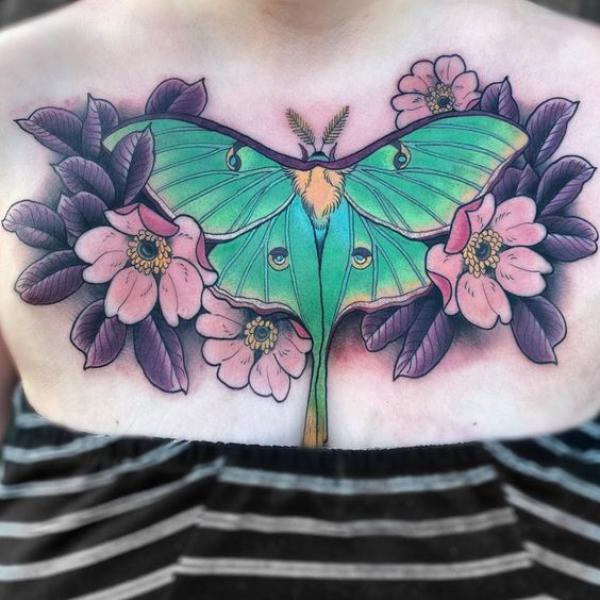 luna moth with flowers chest tattoo