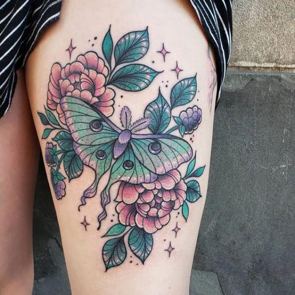 luna moth with peony thigh tattoo