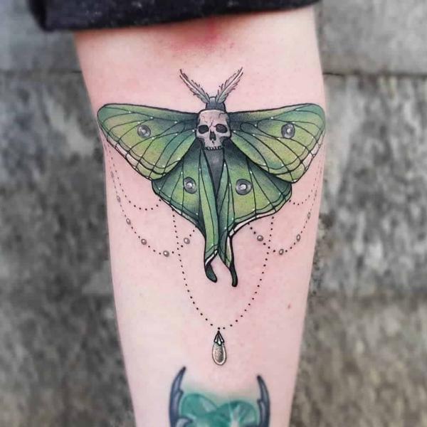 luna moth with skull tattoo