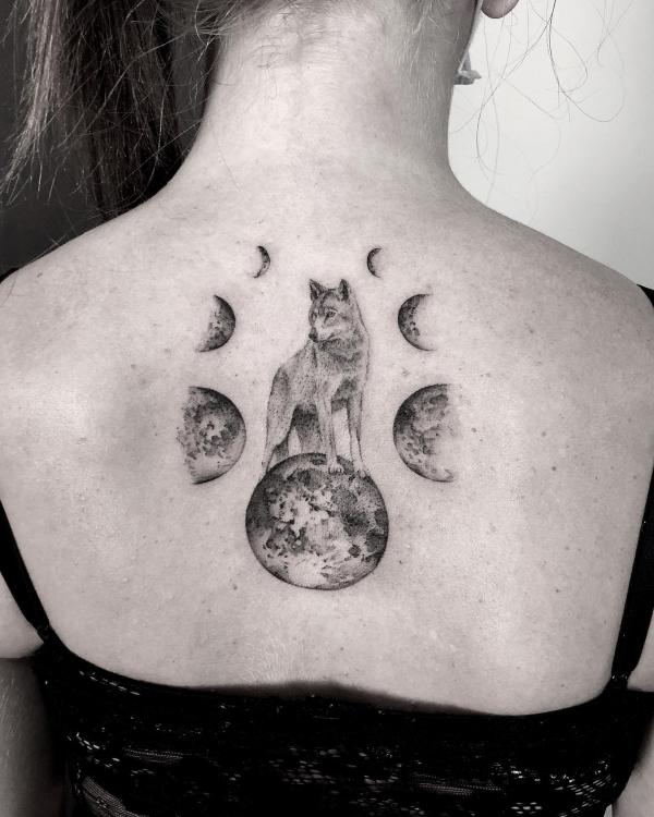 moon cycle with wolf tattoo