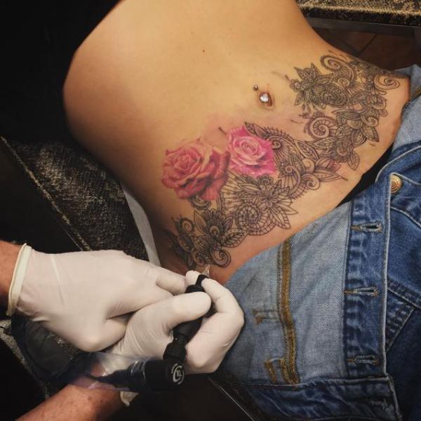 paisley pattern with roses abdomen tattoo