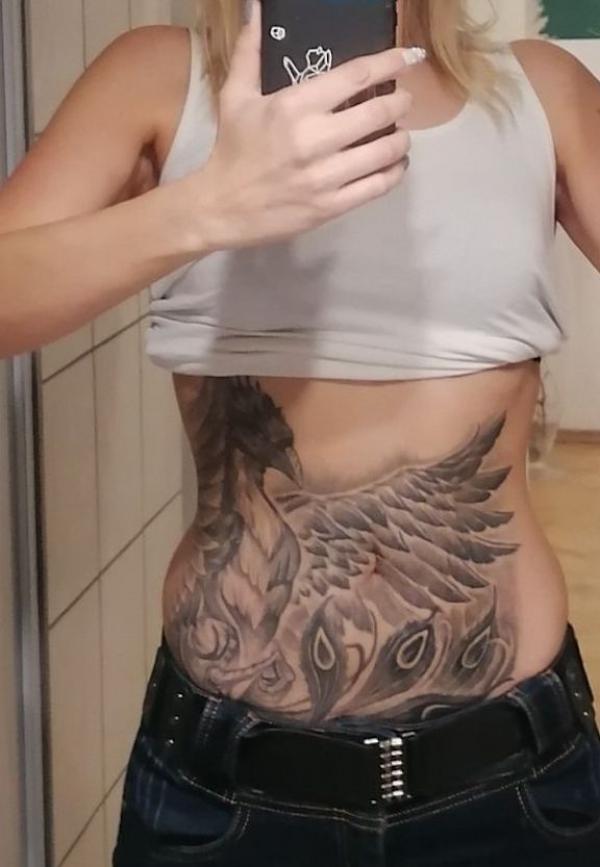 peacock wing stomach tattoo