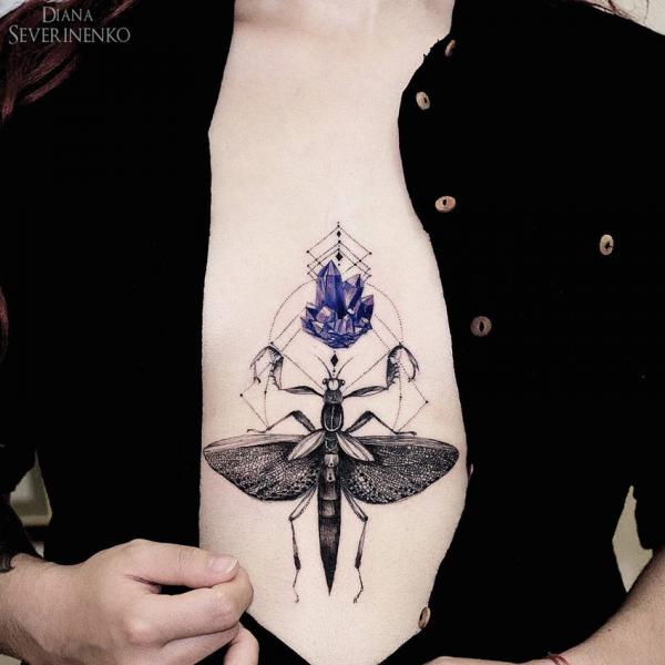 praying mantis and crystal sternum tattoo