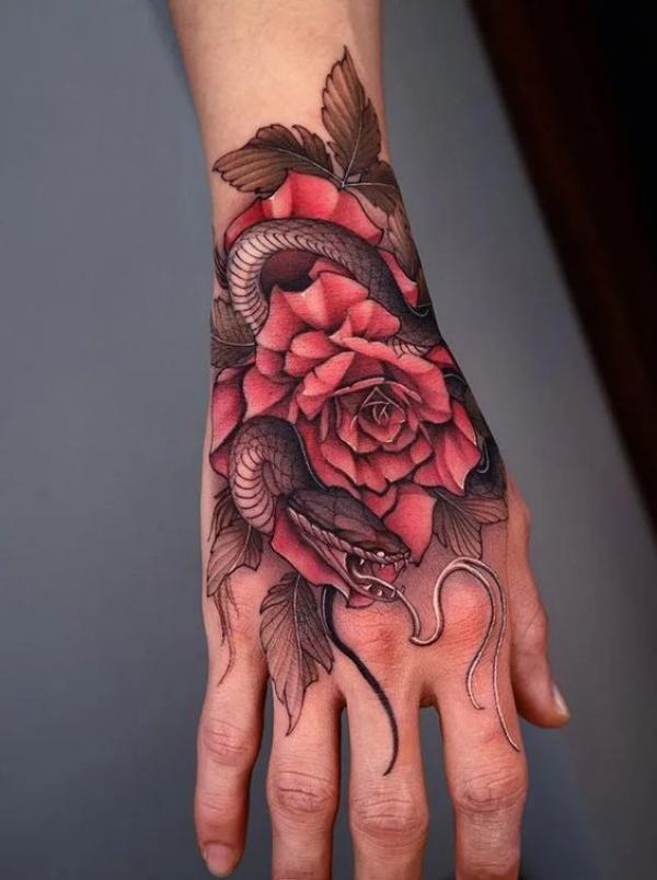 snake and rose hand tattoo