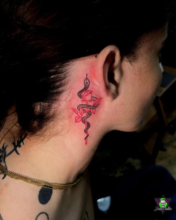 snake and rose tattoo behind the ear