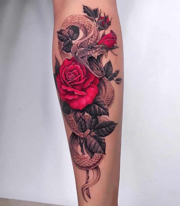 snake and rose tattoo on calf