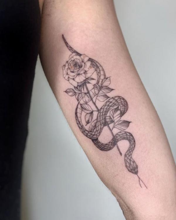 snake and rose upper arm tattoo