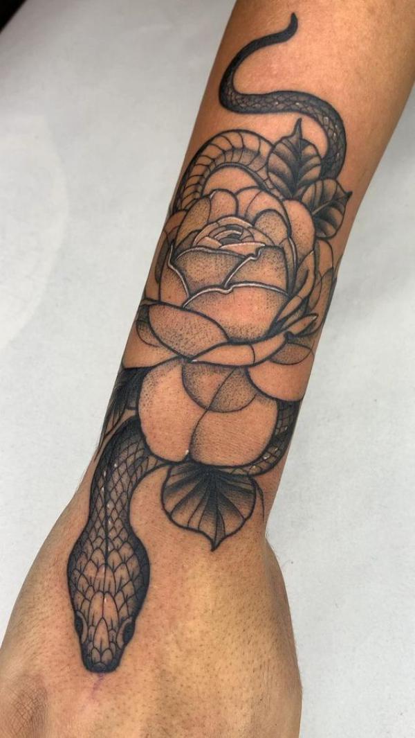 snake and rose wrist tattoo