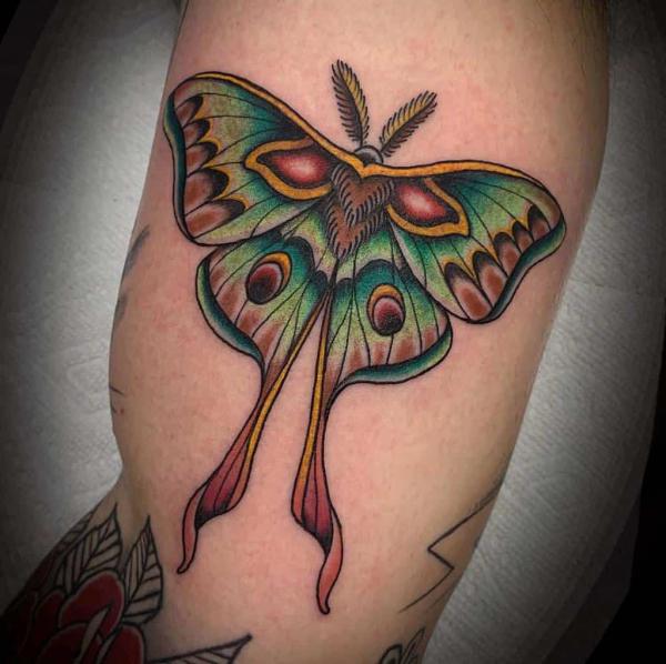 traditional luna moth bicep tattoo