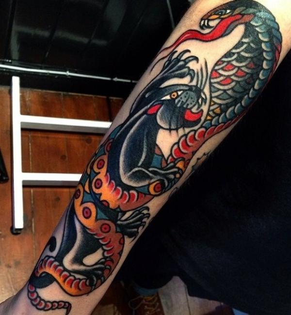 traditional panther and cobra tattoo forearm