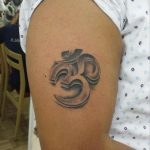 3D OM tattoo upper arm