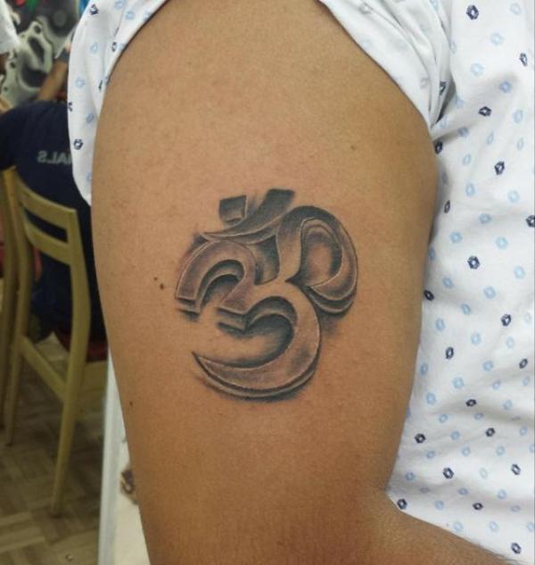 3D OM tattoo upper arm