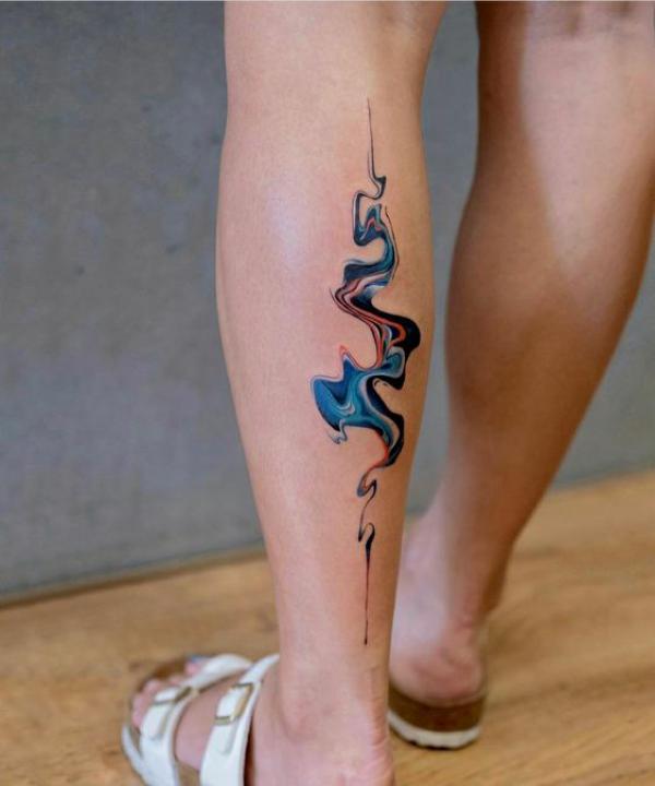 Abstract smoke lower leg tattoo
