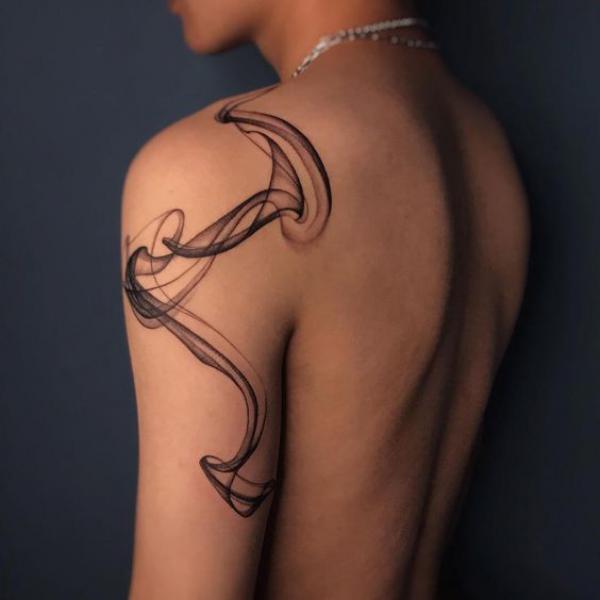 Abstract smoke shoulder arm tattoo