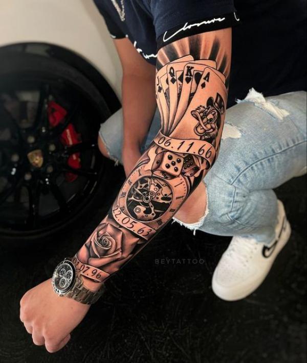 Ace of spade and dice with clock and rose tattoo sleeve