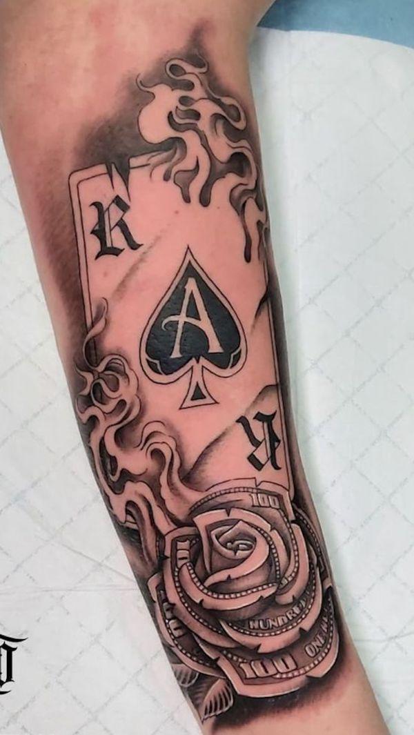 Ace of spade and money rose tattoo forearm