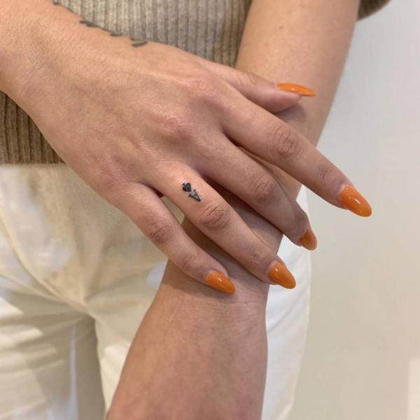 Ace of spade finger tattoo