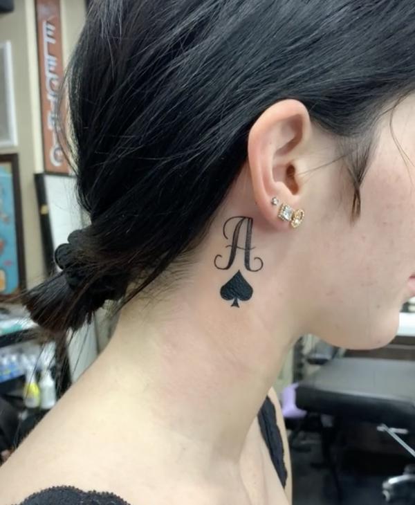 Ace of spade tattoo behind the ear