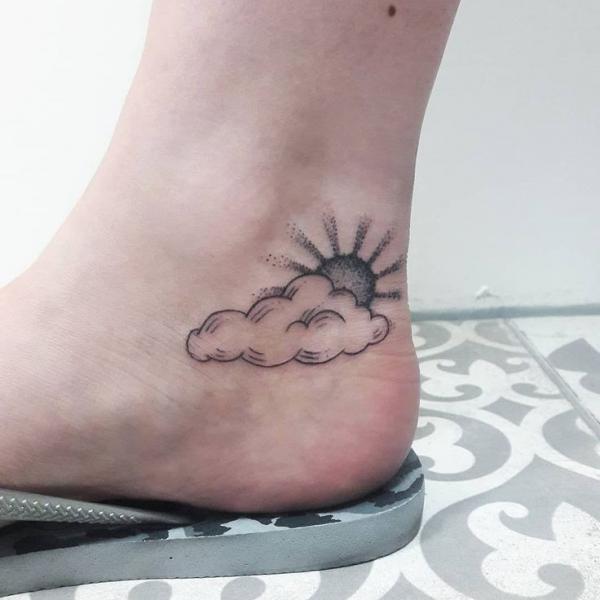 Ankle sun and clouds tattoo black and grey