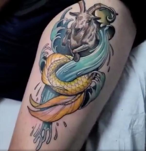 Aquarius and capricorn tattoo thigh 1