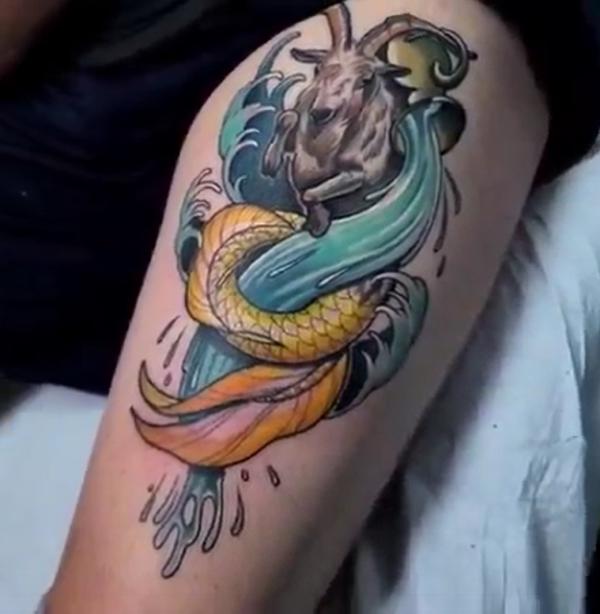 Aquarius and capricorn tattoo thigh
