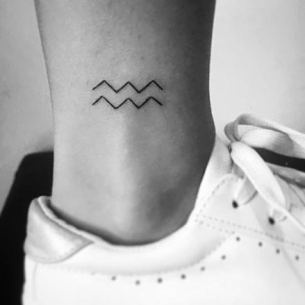 Aquarius ankle tattoo