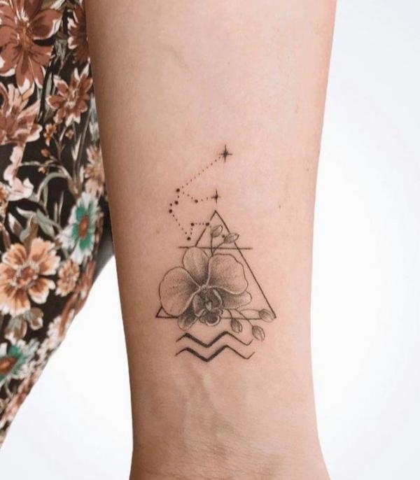 Aquarius constellation and orchid tattoo