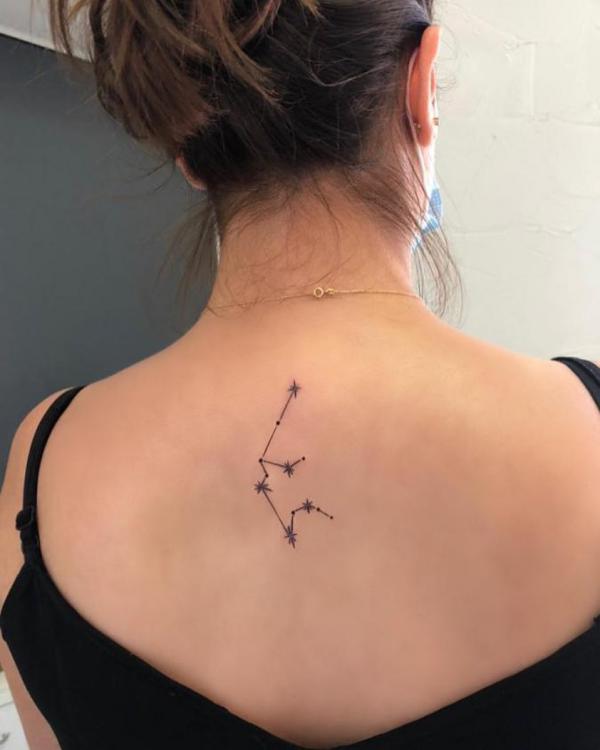 Aquarius constellation tattoo on upper back