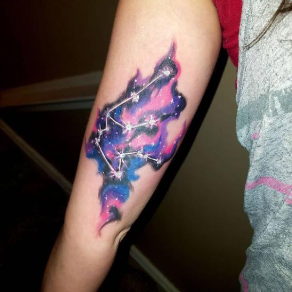 Aquarius constellation upper arm tattoo