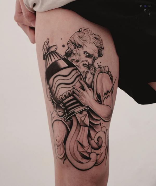 Aquarius pouring water tattoo thigh