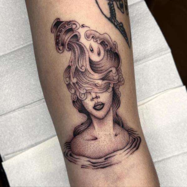 Aquarius pouring water woman tattoo