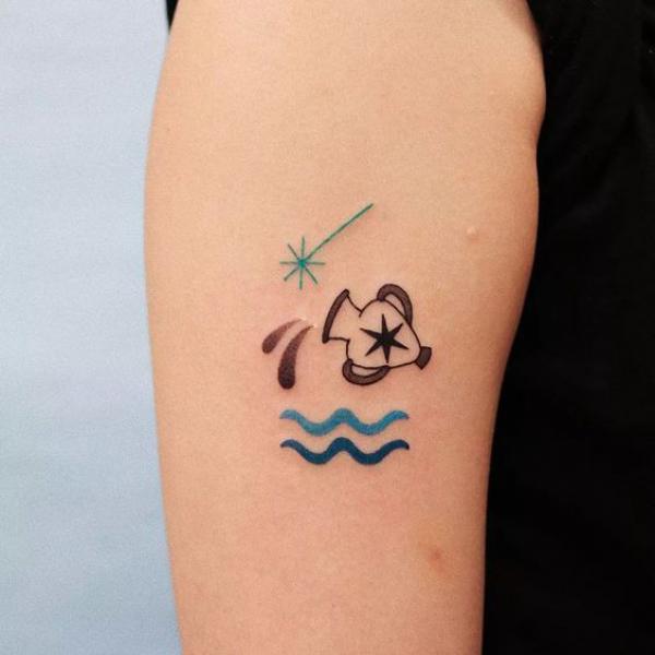 Aquarius sign and shooting star tattoo