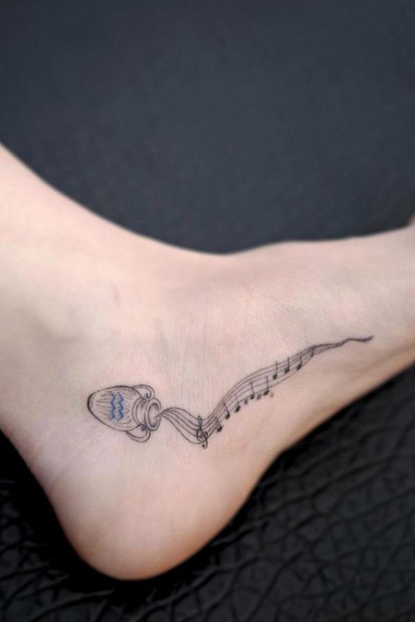 Aquarius water bearer pouring music notes tattoo foot